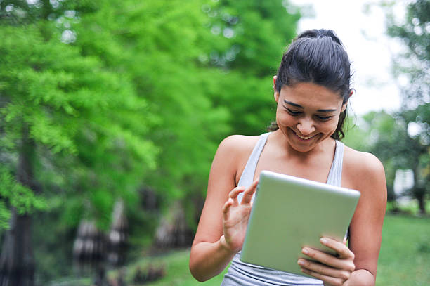 istock Young Woman looking at a digital tablet 470040670