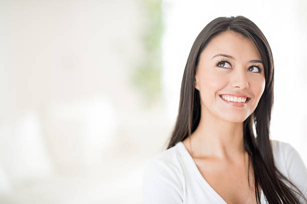 istock Pensive woman looking up 470041900