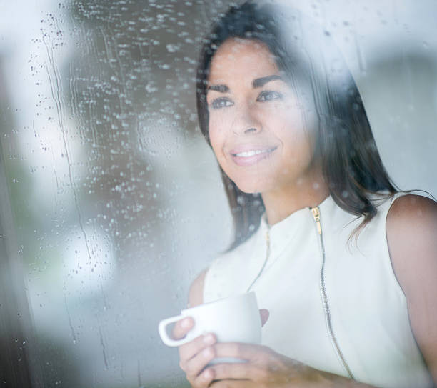 istock Thoughtful woman on a rainy day 470041936