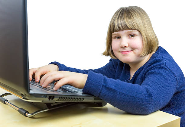 istock Young dutch girl working on laptop computer 470043094
