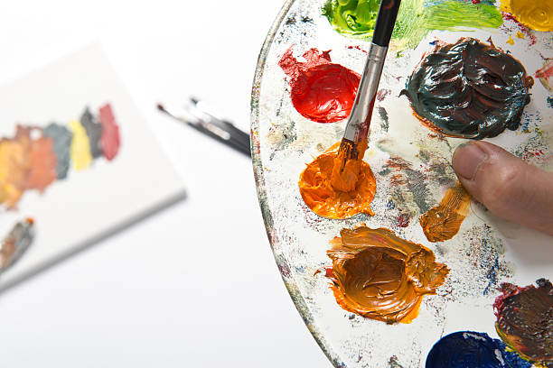 istock Painter mixing colors in the palette 470044264