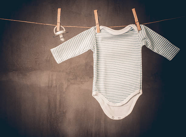 istock Baby onesie and baby pacifier 470046914