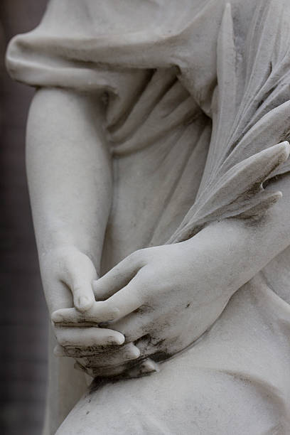 female hands of a statue stock photo