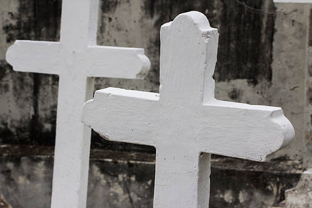 Graves with crosses in a abandoned cemetery stock photo