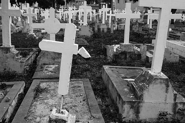 Graves with crosses in a abandoned cemetery stock photo