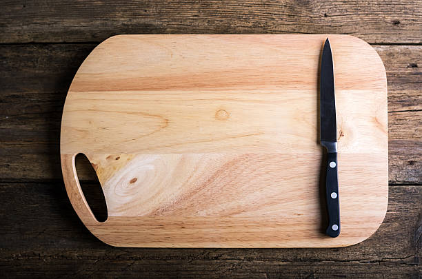 istock knife fork and napkin plaid  a cutting board wooden background 470055496