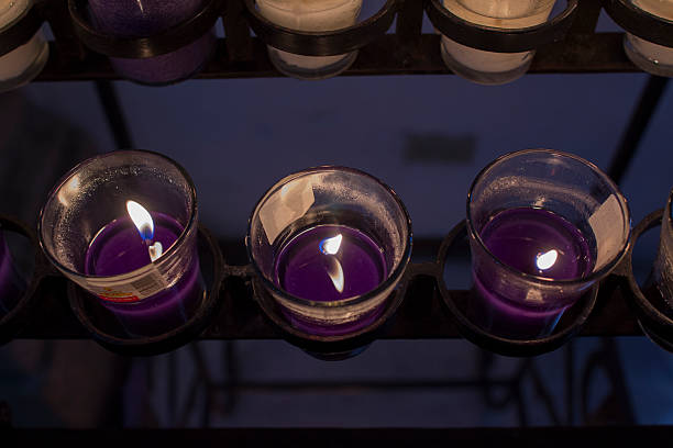 Lit purple Candle stock photo