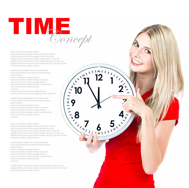 istock time concept. five to twelve. young beautiful woman with clock 470057859