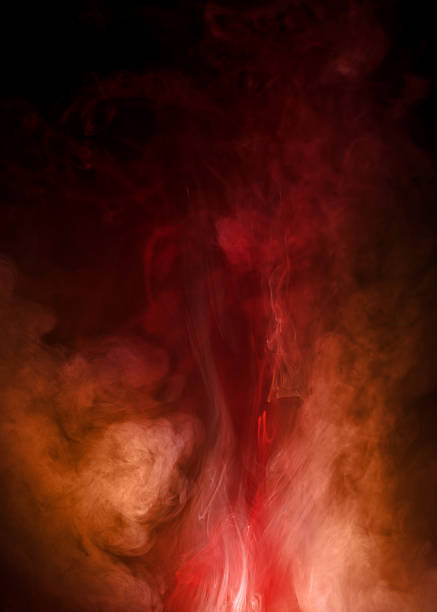 istock Fiery, Red Smoke Billowing and Swirling on Black Background 470059095
