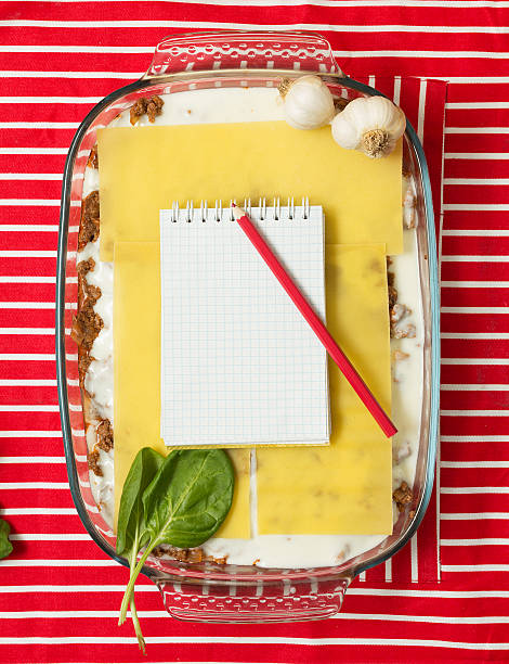 Cooking lasagna Making of tasty Italian lasagna on a bright background beef pad stock pictures, royalty-free photos & images