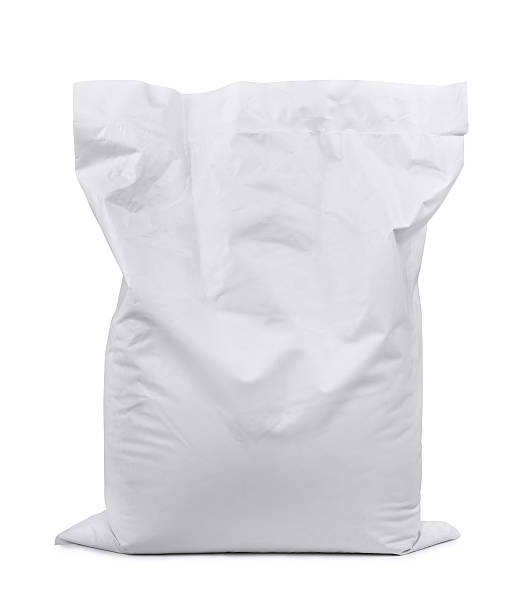 Plastic sack White plastic sack isolated on white cement bag stock pictures, royalty-free photos & images