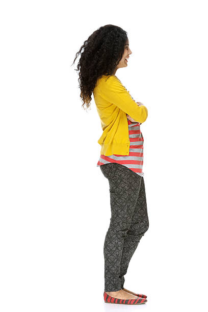 istock Smiling woman standing with arms crossed 470064061