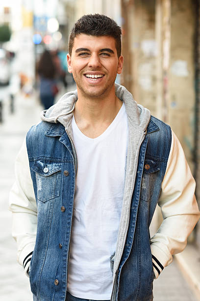 istock Handsome young man with blue eyes walking in the street 470065308