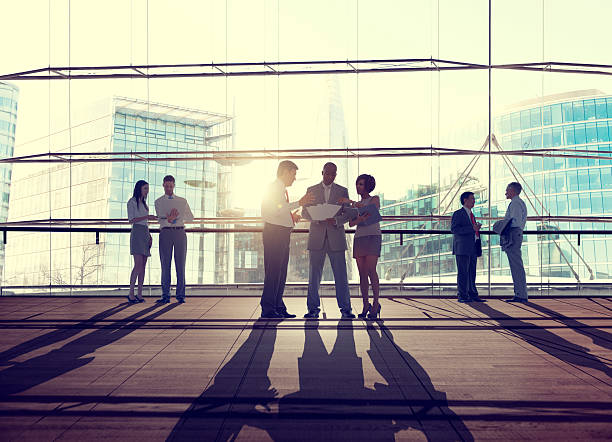 istock Back Lit Business People Discussion Cityscape Meeting Concept 470069392