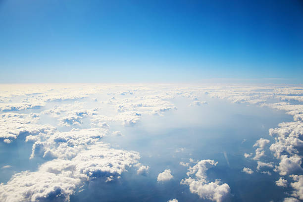 istock aerial view of clouds and blue sky from airplane 470069554