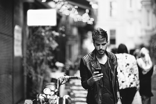 Man using smartphone at the street