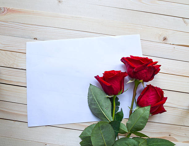 istock Red roses on a wooden table 470071210