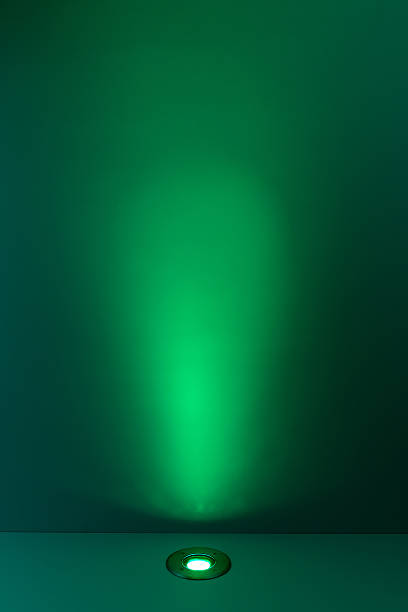 istock Green color background with lighting bulb 470071382