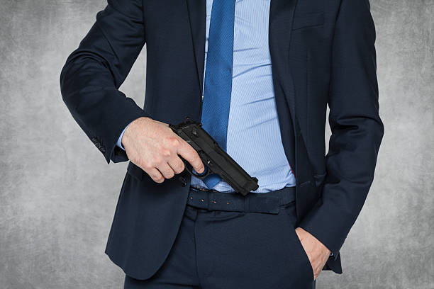 istock businessman with a gun 470072072