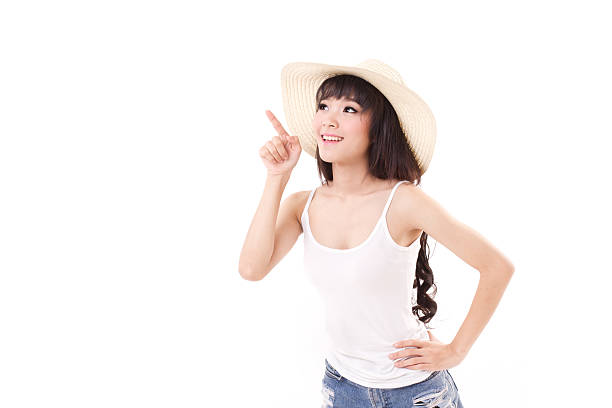 istock woman pointing, looking up, white isolated background 470075864