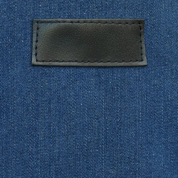 blue jeans label - leather patch denim jeans stock-fotos und bilder