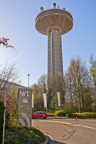 Brussels, Belgium - April 15, 2015: The Reyers Tour telecommunication tower of Belgian national television, the RTBF and VRT. It is located in Schaerbeek, in Brussels at the boulevard Reyers. This is the VRT entrance