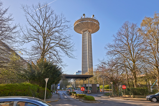 Brussels, Belgium - April 15, 2015: The Reyers Tour telecommunication tower of Belgian national television, the RTBF and VRT. It is located in Schaerbeek, in Brussels at the boulevard Reyers. This is the VRT entrance