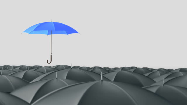 Blue umbrella standing out from crowd mass concept