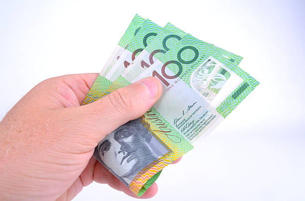 istock Handful of one hundred Australian dollar notes 470079564
