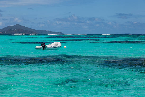 istock Lone Empty Dinghy Boat Floating Tropical Water 470083350
