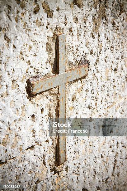 Iron Cross Snuggled In Stone Stock Photo - Download Image Now - 2015, Catholicism, Christianity