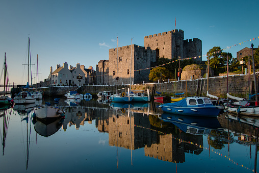 Castletown, Isle of Man, UK, August 7, 2014: Historic castle and harbor at sunrise.