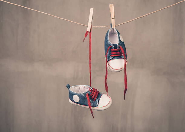 istock Blue and red baby shoe 470085618
