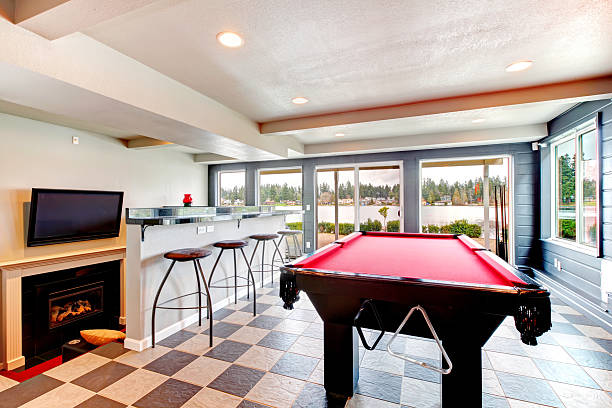 istock Elegant entertainment room with pool, bar and fireplace 470086481