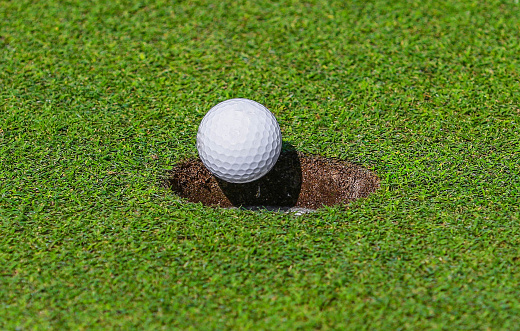 Golf Ball Going Into Hole