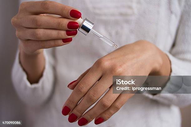 Hands To Apply The Serum Stock Photo - Download Image Now - 2015, Adult, Applying