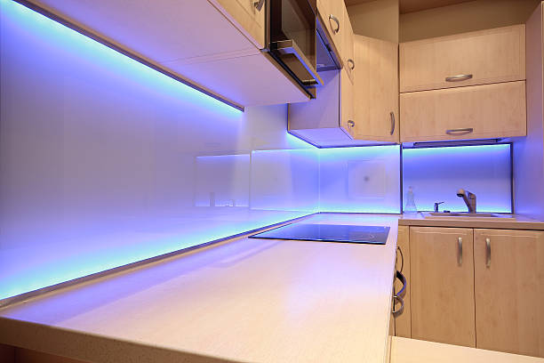Modern luxury kitchen with purple LED lighting stock photo