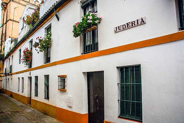 Santa Cruz - Seville, Spain Street in the old Jewish District (Santa Cruz) of Seville, Spain. santa cruz seville stock pictures, royalty-free photos & images