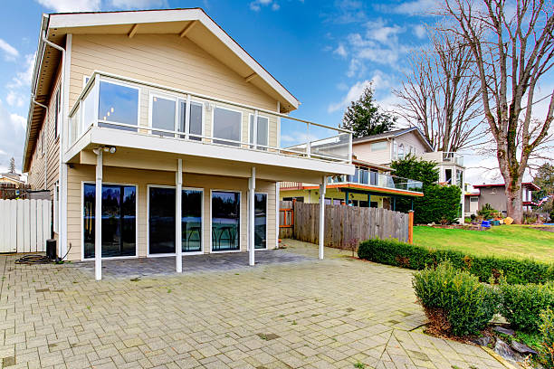 istock Two story paneled house with glass balcony 470096389