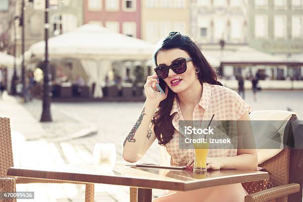Young Woman Talking On Phone Outdoor Stock Photo - Download Image Now - 2015, Adult, Bar - Drink Establishment