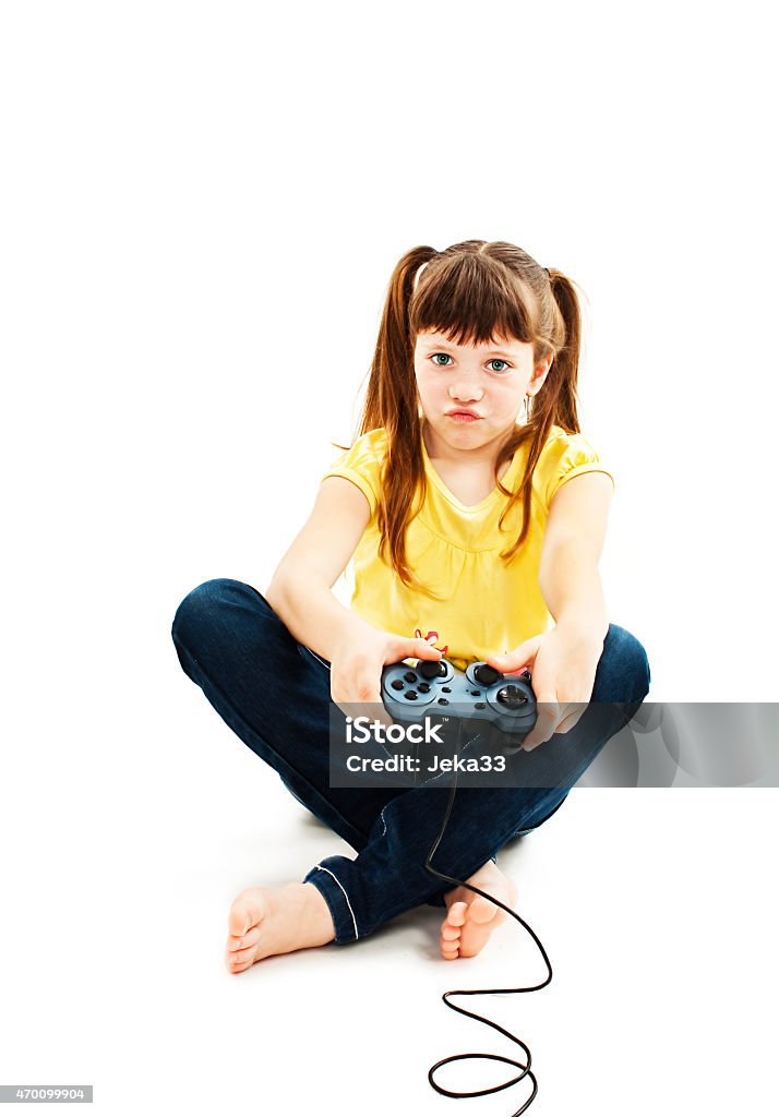 Girl using video game controller Girl using video game controller Isolated on white background Teenage Girls Stock Photo