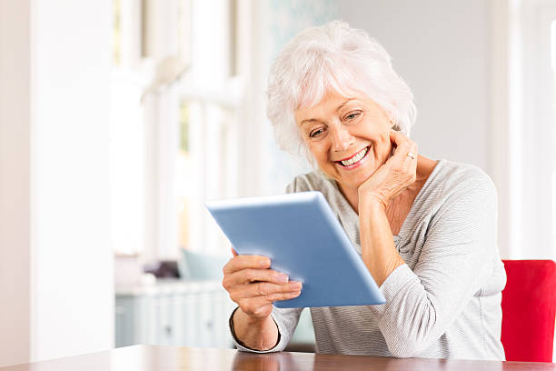 istock Senior Woman With Digital Tablet. 470110627