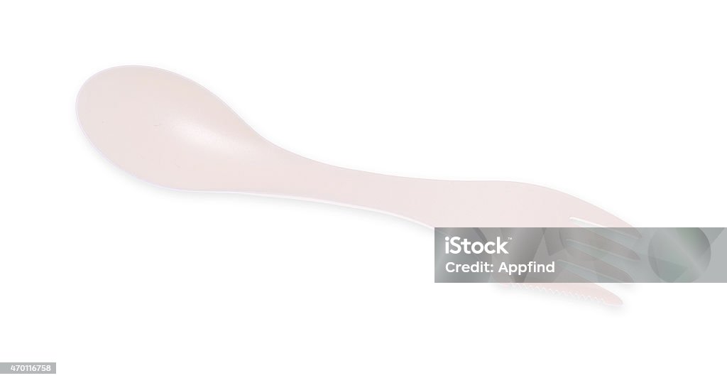 Plastic cutlery White plastic cutlery with fork, knife and spoon in one. Isolated on white background 2015 Stock Photo