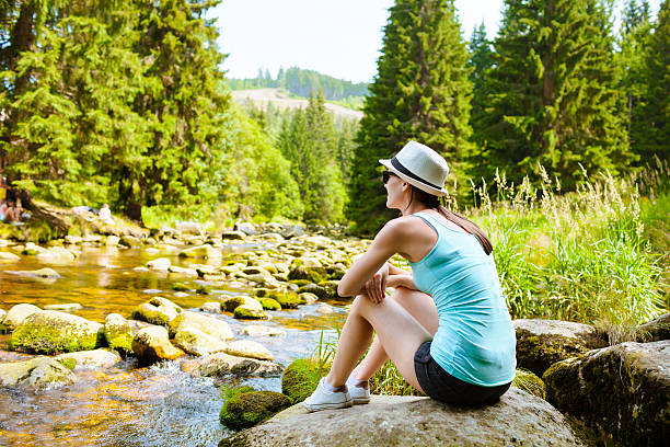 istock Relaxing young woman in nature 470116936