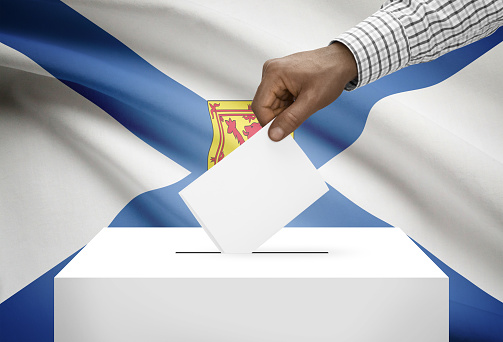 Voting concept - Ballot box with Canadian province flag on background - Nova Scotia