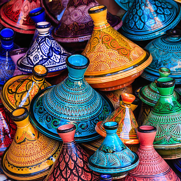 Colorful Maroccan tajine pots at a souk in Marrakech Colorful Moroccan cooking pots at a souk in Marrakech. A tajine is a Maroccan dish from that is named after the special earthenware pot in which it is cooked.http://bem.2be.pl/IS/morocco_380.jpg casbah photos stock pictures, royalty-free photos & images