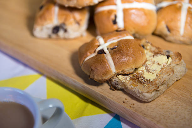 istock Buttered hot cross bun with a cup of tea 470120960