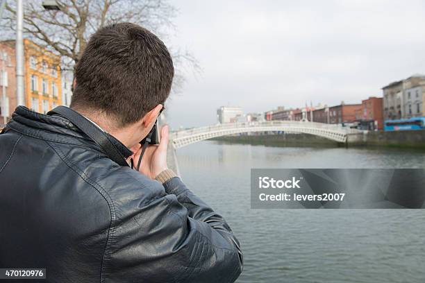 Photographer At Hapenny Bridge Dublin Ireland Stock Photo - Download Image Now - 2015, Adult, Adults Only