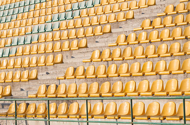 istock yellow chairs on the soccer field 470121736