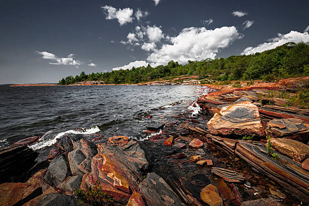 Rocky shore of Georgian Bay Georgian Bay landscape with rugged rocky lake shore near Parry Sound, Ontario, Canada. northern ontario stock pictures, royalty-free photos & images